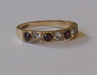 A gold half eternity ring set rubies and diamonds