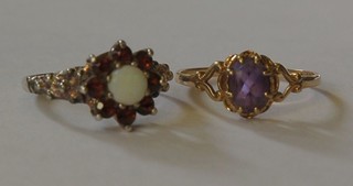 A 9ct gold dress ring set an amethyst and 1 other dress ring