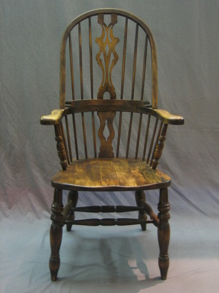 A 20th Century, 18th Century style elm open arm carver chair