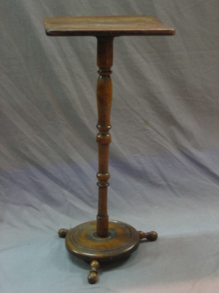 A 19th Century rectangular bleached mahogany wine table raised on a turned column with circular base 13"