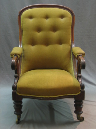 A William IV mahogany open arm chair raised on brass caps and castors