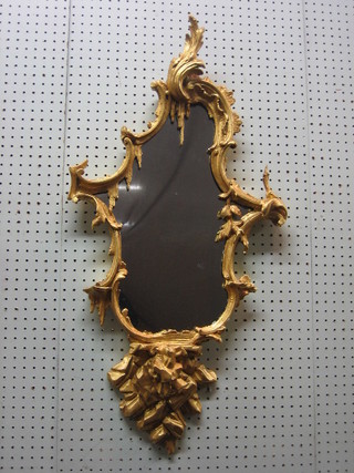 A 19th Century Chippendale style plate mirror contained in a decorative gilt frame 34"