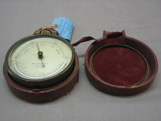 An aneroid barometer and thermometer by Smith Beck & Beck of London contained in a drum case 5", complete with original leather outer case (requires some attention)