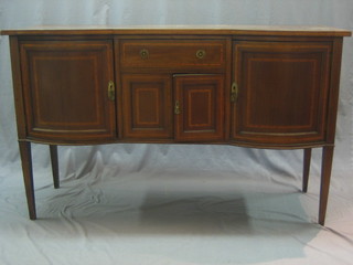 An Edwardian Georgian style inlaid mahogany sideboard fitted a drawer above a double cupboard flanked by a pair of cupboards, raised on square tapering supports with crossbanded top (top split and some damage to top right hand side) 60"
