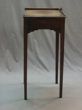 A 19th/20th Century mahogany urn table with three-quarter gallery having a slide and raised on square tapering supports 13"
