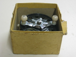 A Raraply Star Drag centre pin fishing reel 4 1/2", boxed