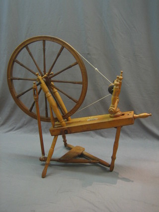 A yew and elm spinning wheel by Diryad of Leicester