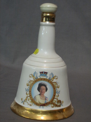 A Wade decanter for Bells whisky and contents to commemorate the 60th Birthday of HM The Queen