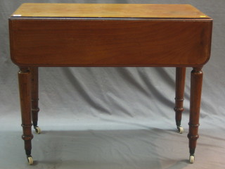 A Victorian mahogany Pembroke table fitted a drawer, raised on turned supports 35"