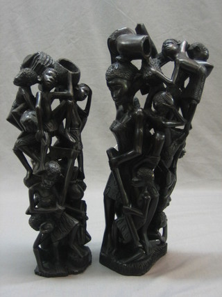 A pair of heavily carved African standing figures 16"