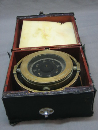 A gimbled ships compass complete with carrying case