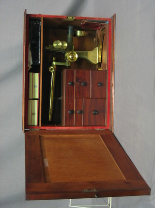 A 19th Century brass single pillar microscope by A Ross London no. 307, contained in a mahogany box