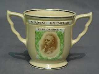 A Royal Doulton twin handled mug to commemorate George V Jubilee