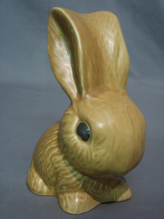 A Sylvac brown glazed figure of a seated rabbit, the base marked 1028 9"