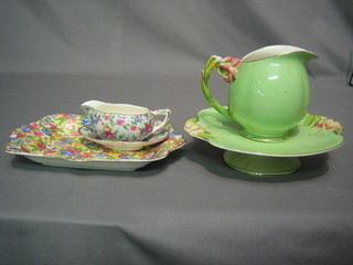 A Royal Winton green glazed twin handled bowl 9", a matching jug 5", 10", a do. sauce boat and stand (stand chipped)