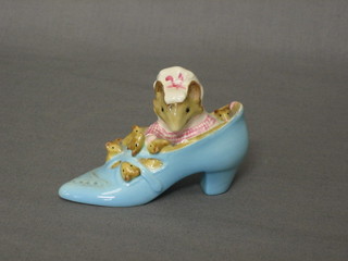 A Beswick Beatrix Potter figure The Old Woman Who Lived in a Shoe, with gold stamp to base marked F Warren & Co