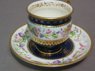 A Sevres porcelain cabinet cup and saucer with deep blue ground, floral decoration and gilt banding, the base marked Decorea Sevres 61
