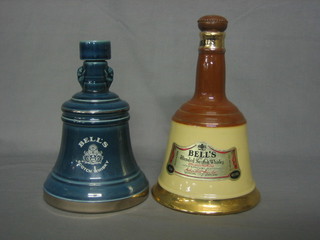 A Bells blue glazed Wade Whisky decanter with some contents together with a Bells Wade Whisky decanter empty