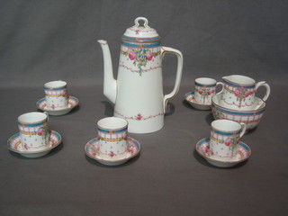 A 13 piece Royal Worcester coffee service with blue banding and floral decoration, the base with purple Worcester mark and 7 dots comprising coffee pot (cracked), cream jug (cracked), sugar bowl, 5 coffee cans and saucers (4 cans cracked, 3 saucers cracked)