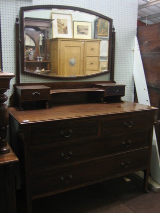 An Edwardian inlaid mahogany dressing table with oval mirror and 2 long glove drawers, the base fitted 2 short and 2 long drawers, raised on square tapering supports 44"