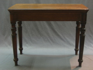 A Victorian D shaped oak card table, raised on turned and fluted supports 36"