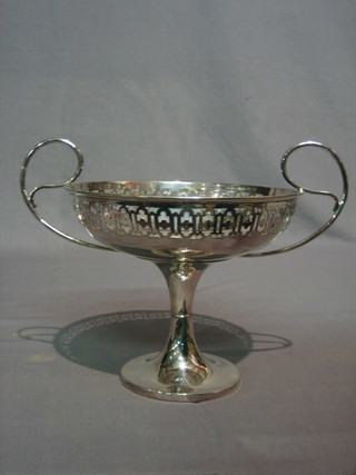 A circular pierced silver plated twin handled bowl 9"