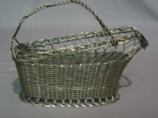 A pierced silver plated wine bottle basket