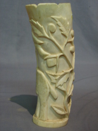 A carved ivory vase decorated elephants 10"