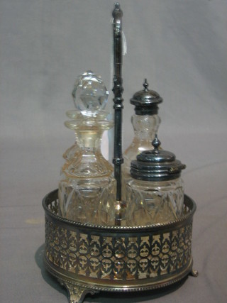 A Victorian circular silver plated bottle cruet with 4 glass bottles