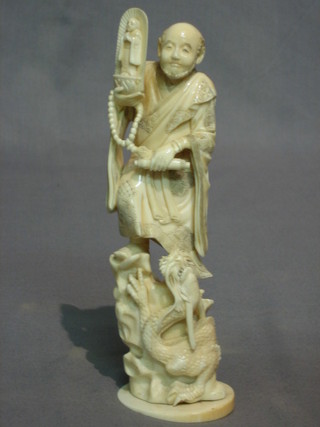 A 19th Century Japanese carved ivory figure of a standing sage with dragon, base with red signature mark 8"