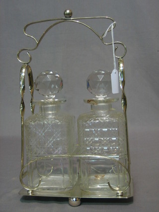 A silver plated 2 bottle decanter stand and 2 hobnail cut decanters (1 chipped)