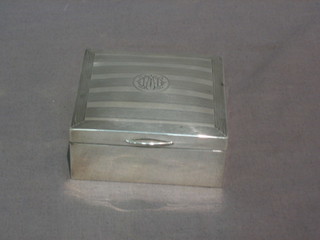 A silver cigarette box with hinged lid Birmingham, 3" marks rubbed
