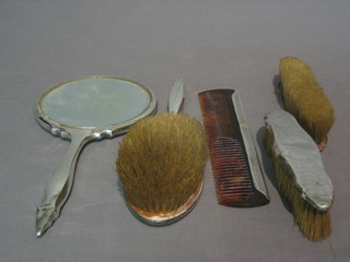 An Art Deco 5 piece silver backed dressing table set with hand mirror, hair brush, 2 clothes brushes and comb (some dents)