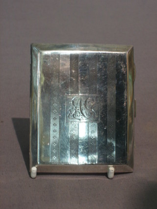A silver cigarette case, Birmingham 1923, 2 ozs