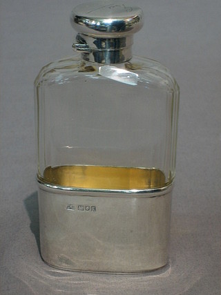 A glass hip flask with detachable silver cup and collar, London 1911 by Mappin Bros