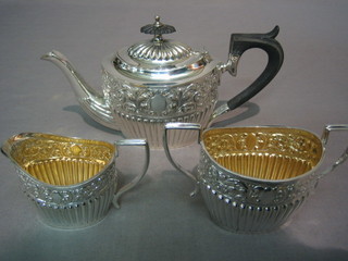 A Victorian embossed 3 piece silver plated Bachelor's tea service comprising teapot, twin handled sugar bowl and cream jug