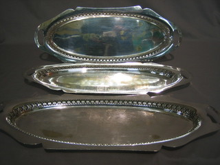 3 oval pierced silver plated trays raised on bun feet 21"