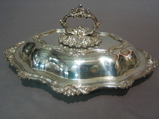 An oval silver plated entree dish and cover by Selfridges & Co