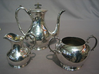 A silver plated 3 piece coffee service comprising coffee pot, twin handled sugar bowl and cream jug by Mappin Bros.