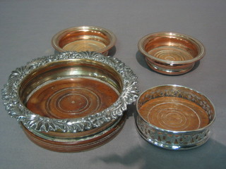 A 19th Century silver plated bottle coaster 6", 2 small coasters 4" and 1 other 4"
