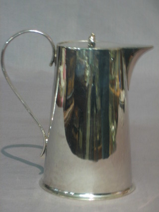 An oval silver plated hotwater jug