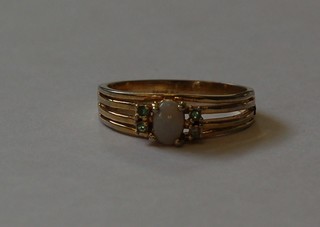 A lady's gold dress ring set an "opal" and 4 other stones