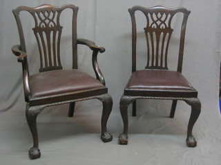 A set of 8 Edwardian mahogany Chippendale style slat back dining chairs with upholstered drop in seats raised on carved cabriole supports
