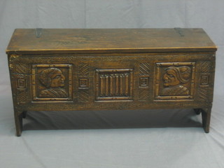 A small oak coffer of panelled construction, the front with carved decoration 37"