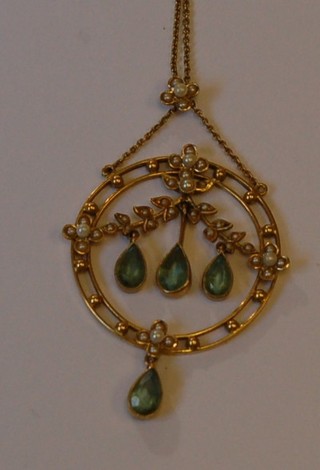 An Edwardian 15ct gold pendant set Peridot and demi-pearls