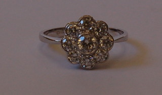 A lady's 18ct white gold cluster dress ring set 9 diamonds approx 1ct