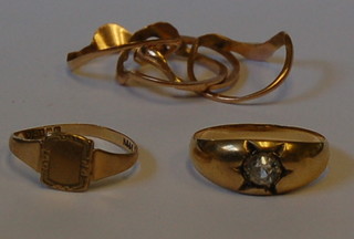 A gold gypsy ring set a white stone, a lady's 9ct gold signet ring and 1 other gold ring