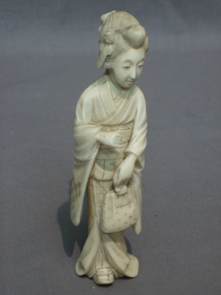 A Japanese carved ivory figure of a standing Geisha girl 6"