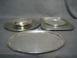 An oval silver plated tray 15", 2 circular ditto 14", 2 rectangular ditto 15", 2 circular do. 8", a muffin dish and cover