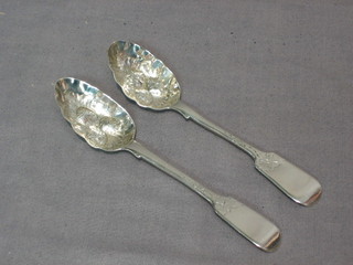 A Victorian Scots silver fiddle pattern teaspoon, the bowl embossed berries Edinburgh 1859 and a similar teaspoon 1 ozs